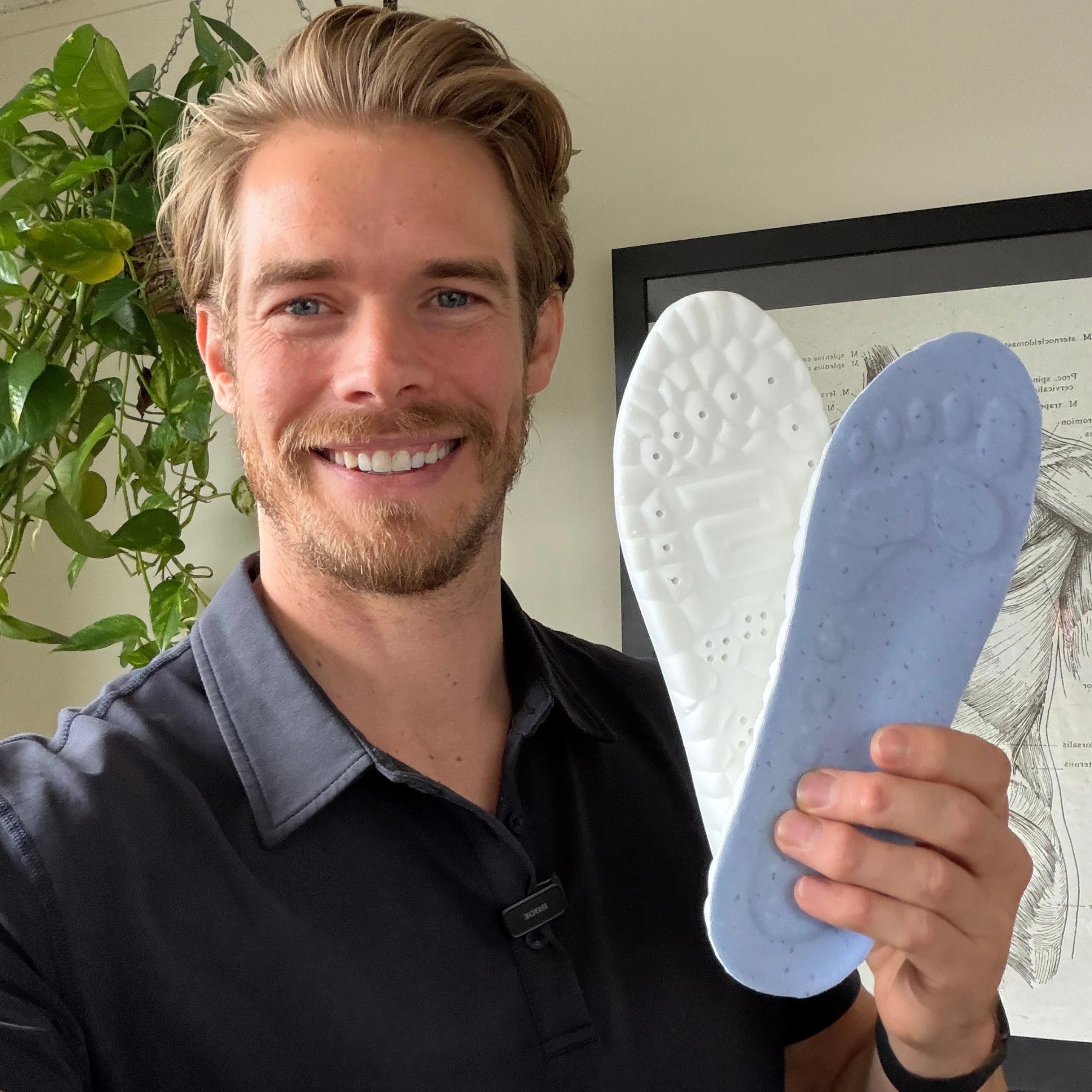 WorkFit customer holding SoleBrace insoles