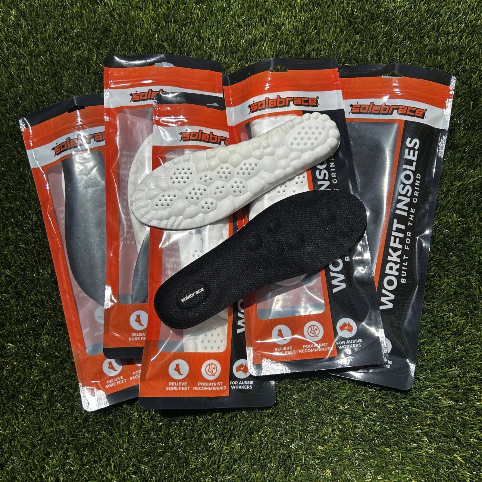Workfit insoles in packaging on a grass background