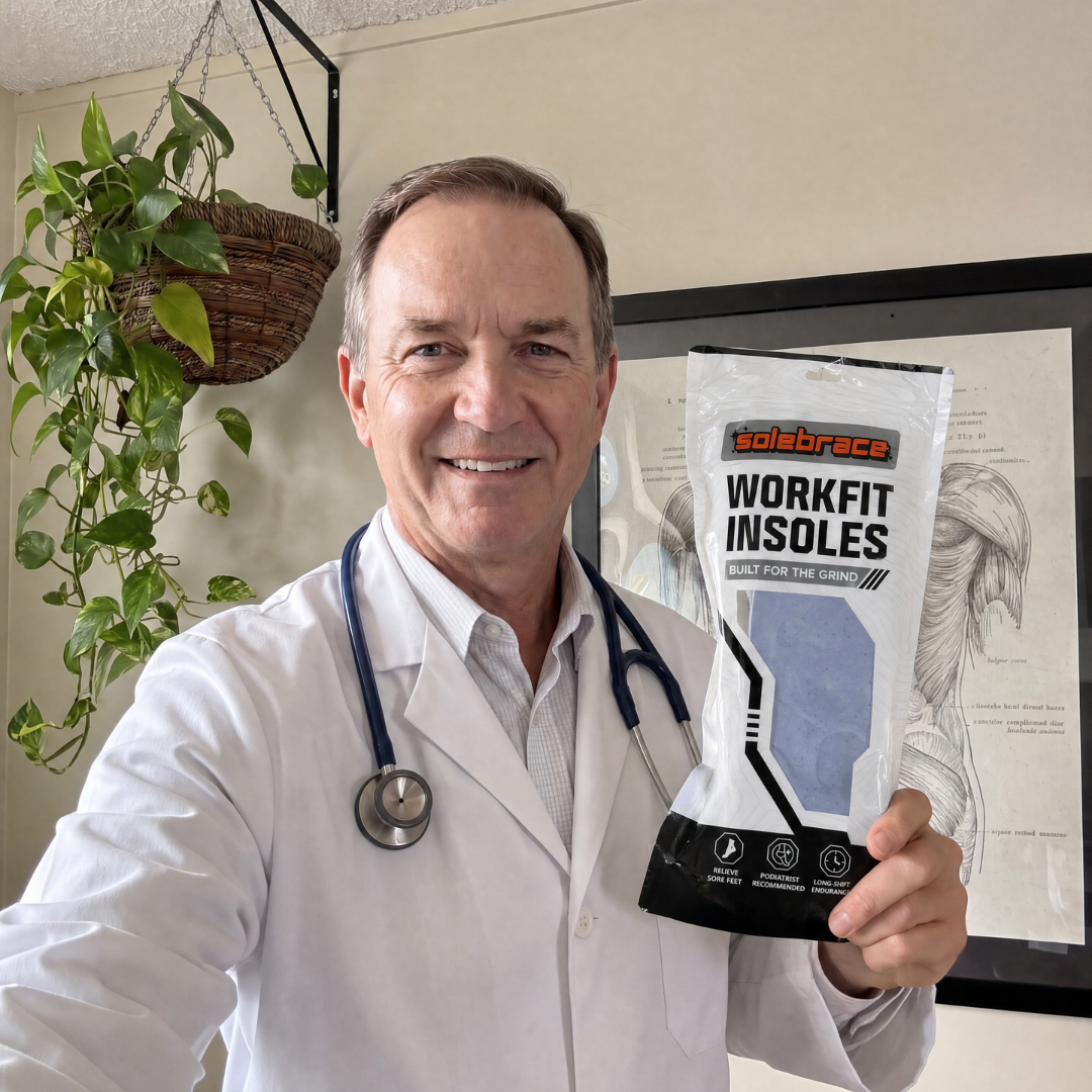 Dr. Torres holding WorkFit insoles packaging