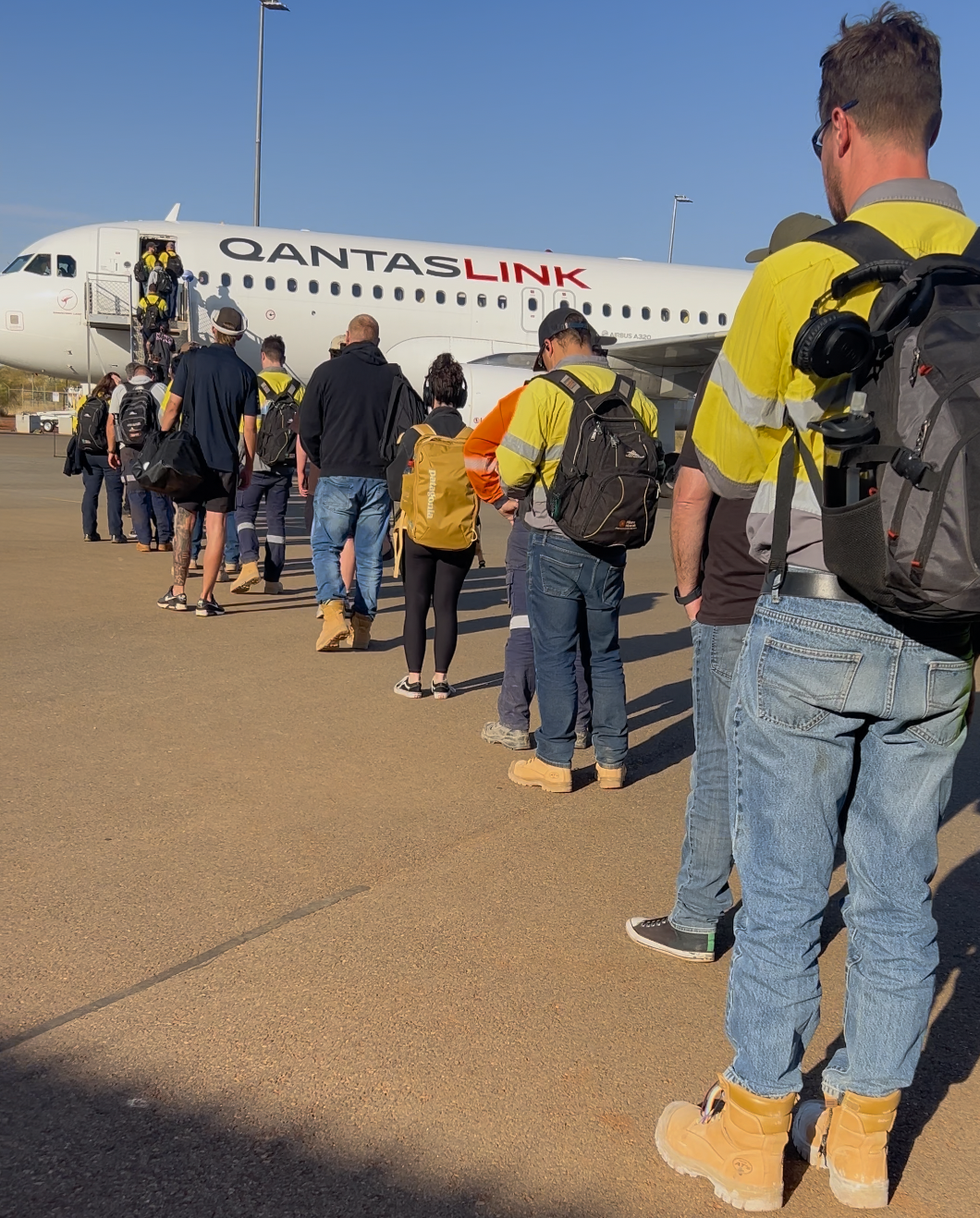 FIFO workers boarding a QantasLink plane before fly-out