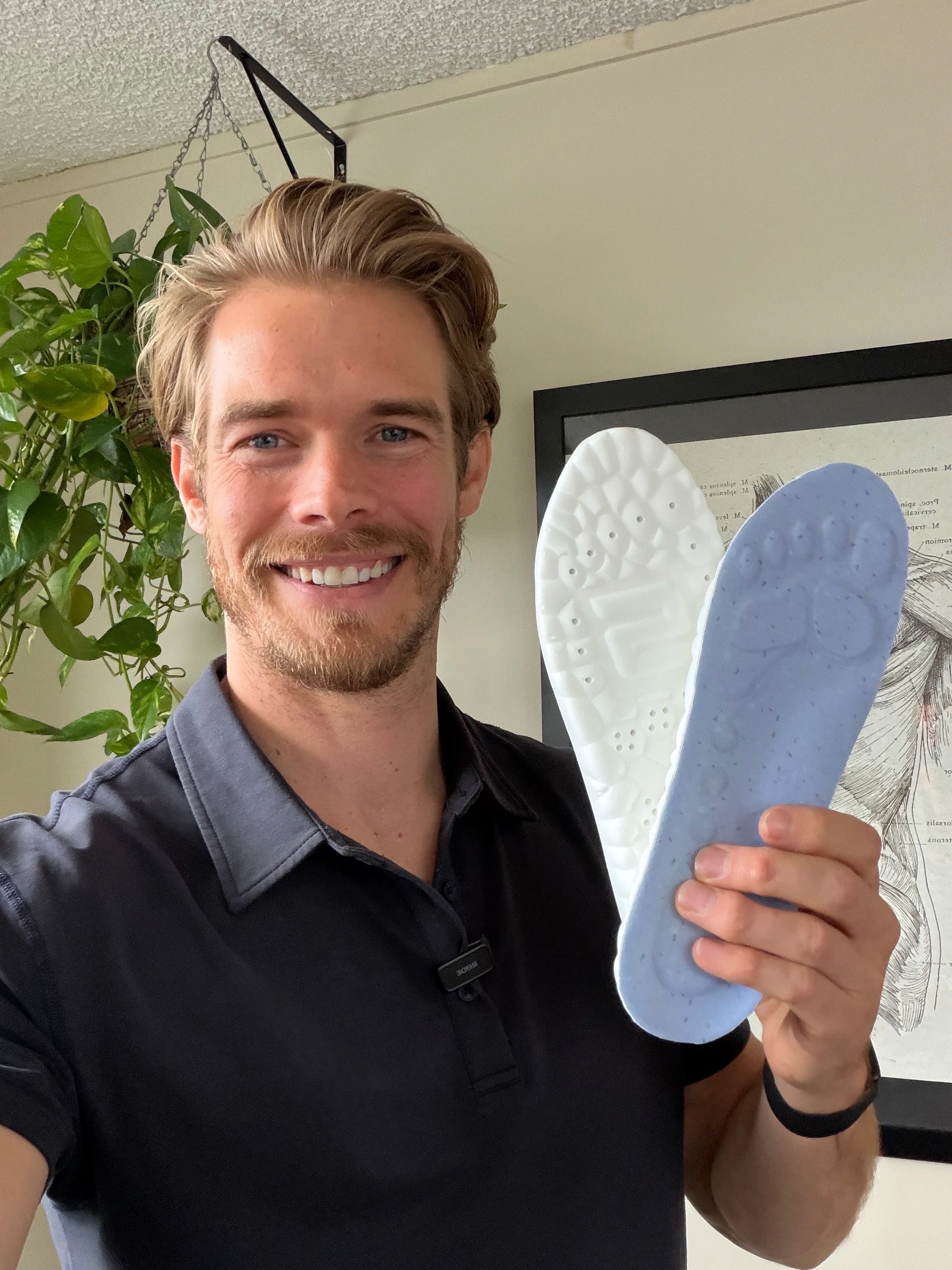 Healthcare professional holding WorkFit Insoles